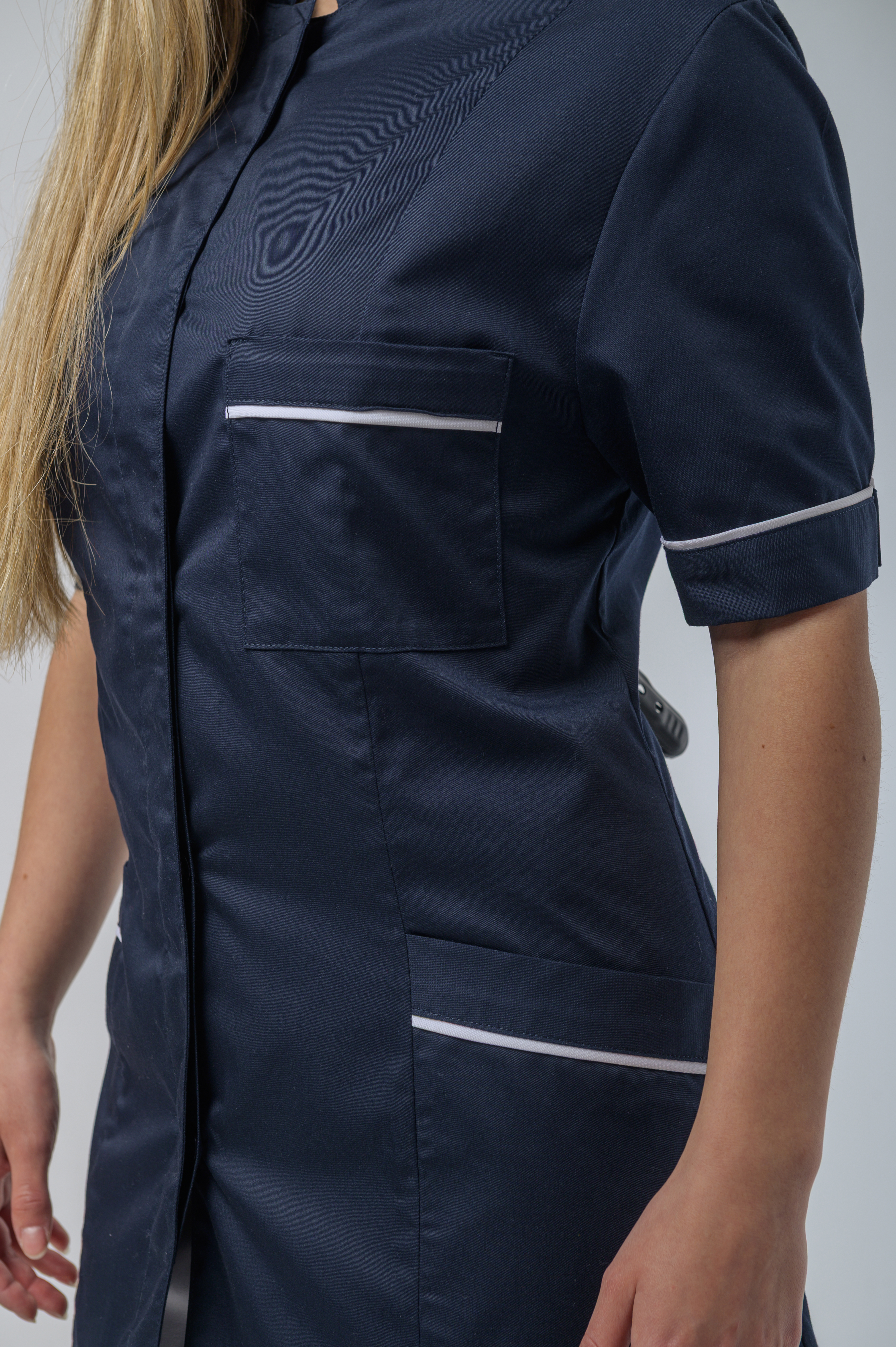 Healthcare facility room with clean white linens and medical equipment